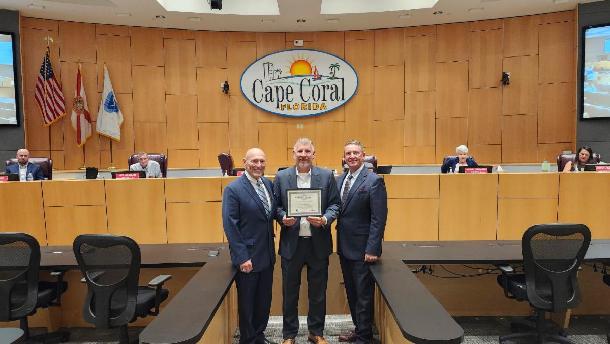 Ed Lavallee, Senior Advisor of FCCMA (left), presented an award to City Manager Michael Ilczyszyn (center) and Mayor John Gunter (right) for the City of Cape Coral's 40 years of service under the council-manager form of government.
